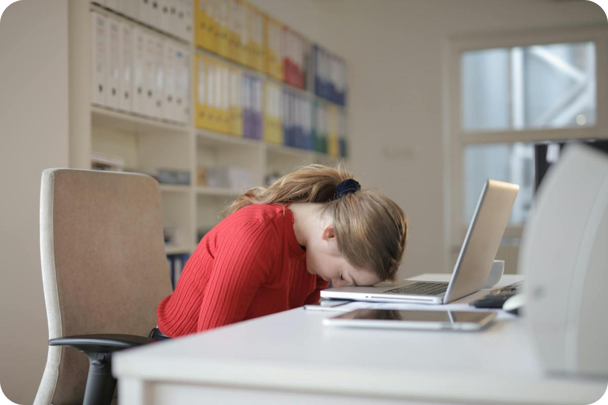 woman overwhelmed in front of a computer