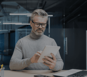 Adult male with a tablet in his hands